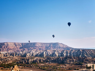 Colorful hot air balloons in the sunny autumn morning. Goreme National Park, Cappadocia, Turkey
