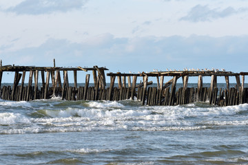 Fototapeta na wymiar Old wooden pier in the Baltic Sea