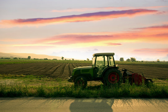 Plowed land and tractor