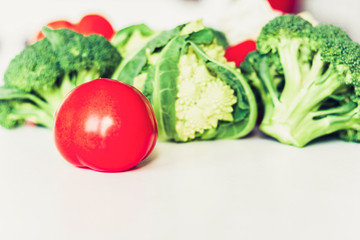 Vegetable variety on wooden white table. Selection of summer and autumn vegetables, space for text