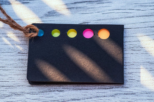 Business card .Business idea concept.Black card with colored bookmarks for notes. Card for notes. Background.