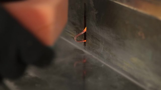 Close-up of technological process for trimming paralon products, shaping shape of sponge for washing dishes, creating hygiene product, light industry enterprise, thermal trimming products, paralon