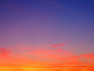 Clouds on orange sunset sky