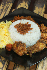 Homemade Indonesian Traditional Food, Rice With Coconut Milk Served With Egg, Chicken, Etc