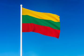 Waving flag of Lithuania on the blue sky background