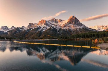 Mount Lawrence Grassi in Canadian Rockies reflection on reservoir in the morning at Rundle Forebay - obrazy, fototapety, plakaty