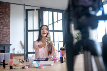 Appealing woman giving recommendation of vitamins to her followers