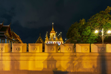 Fototapeta na wymiar Beautiful Loha Prasat or iron monastery of Wat Ratchanatdaram in blue hour in Bangkok, Thailand