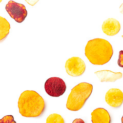 Dried fruit and vegetable chips, healthy vegan snack, an organic food flat lay pattern on a white background, forming a square frame with a place for text