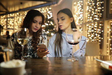 The girl in the evening rest in a cafe