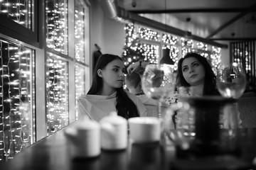 The girl in the evening in a cafe