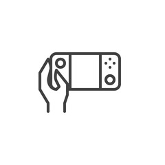 Hand with Video game console line icon. linear style sign for mobile concept and web design. Using portable game pad outline vector icon. Symbol, logo illustration. Vector graphics