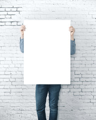 Man holding blank banner