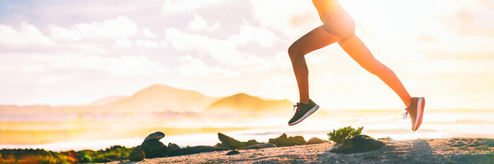Running legs silhouette of runner woman trail running on ultra mountain race on beach landscape...