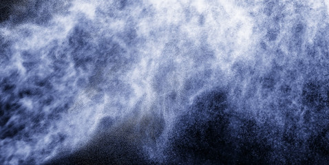 A stream of water and a cloud of drops