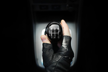 Gear lever. Manual Transmission. Hand on the gear shift in a car.