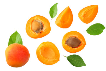 apricot fruits with slices and green leaf isolated on white background. top view - obrazy, fototapety, plakaty