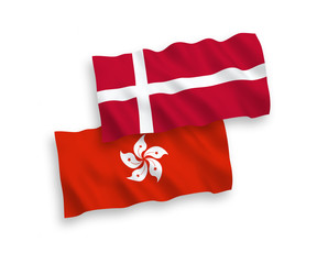 National vector fabric wave flags of Denmark and Hong Kong isolated on white background. 1 to 2 proportion.