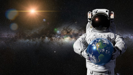 Fototapeta na wymiar astronaut holding planet Earth featuring North, Central and South America