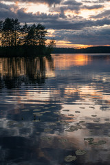 Midnight sun over summer lake in Finland