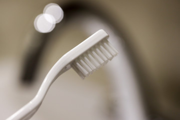 white toothbrush in the bathroom