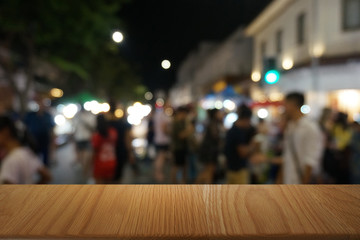 Empty dark wooden table in front of abstract blurred bokeh background of restaurant . can be used for display or montage your products.Mock up for space.