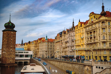 Fototapeta premium PRAGUE,CZECH REPUBLIC/ 01 November 2019: View on old houses with red roofs from Jiraskov bridge in Prague