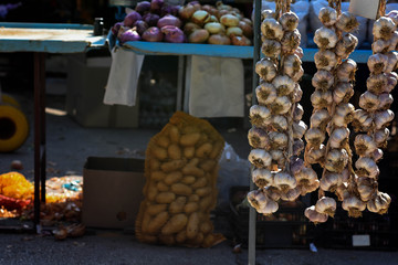 White garlic pile texture. Fresh garlic on market table closeup photo. Vitamin healthy food spice image. Spicy cooking ingredient picture. Pile of white garlic heads. White garlic head heap