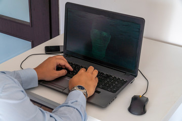 Hacker creating an artificial intelligence software program