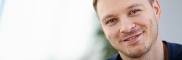 Obraz premium Handsome and Smiling Male Face Closeup Portrait