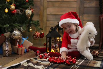 little child and Christmas toys