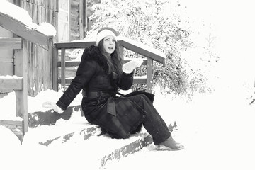 Beautiful girl in winter snowy monochrome