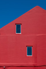 the red building against the blue sky