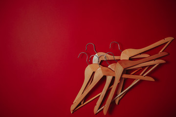 Black friday image with space for text. Bkack friday sale flat lay. Hangers on the red background.