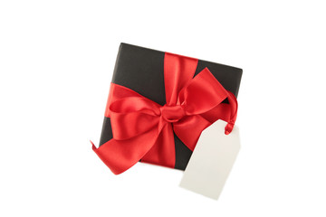 Black gift box with sale tag isolated on white background
