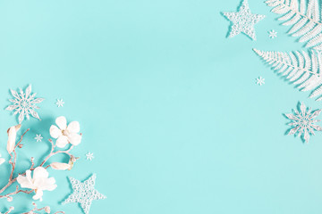 Christmas composition. White decorations on pastel blue background. Christmas, winter, new year concept. Flat lay, top view, copy space