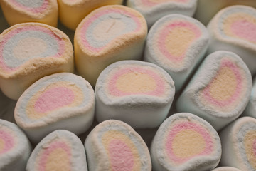 Colorful marshmallows candy as background. Close up view of fluffy candies. 