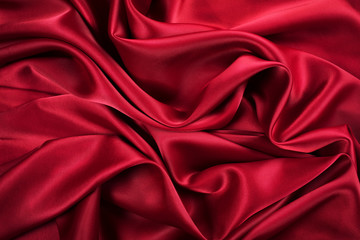 Abstract beautiful deep red textile folded waves. Fashion concept