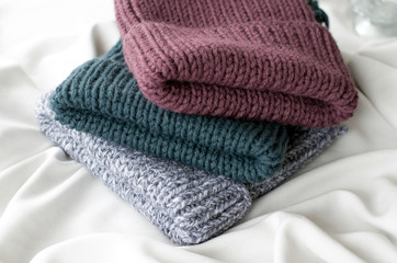 Three knitted winter hats