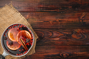 Christmas composition with  hot mulled wine in rustic cup