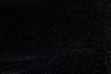 abstract real dust floating over black background for overlay