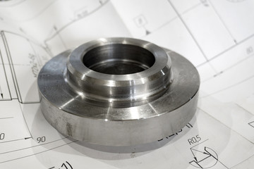 Polished adapter plate on a technical drawing in the industry.