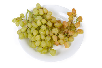 Top view of sultana grape cluster on white dish