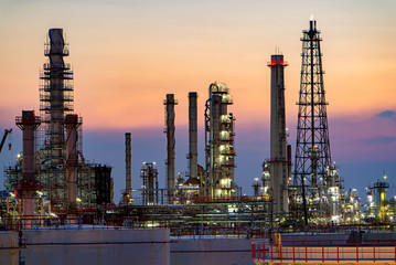 Oil and gas refinery plant area at sunset