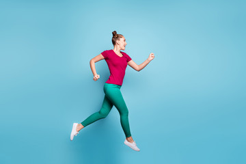 Full length body size side profile photo of hurrying cheerful aspiring girl running jumping for sales isolated over pastel blue color background