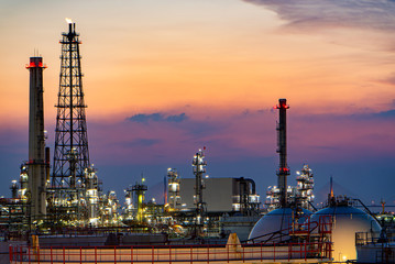 Oil and gas refinery plant area at sunset