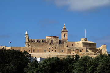 Fototapeta na wymiar St. John's Cavalier and the cathedral of the Cittadella, also known as the Castello, the citadel of Victoria on the island of Gozo, Malta