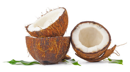 Cracked coconut with leaves isolated on white background