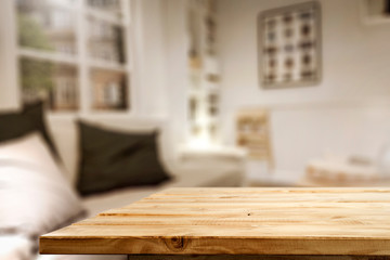 Table top with space for products and decorations or text with blurred home interior background....