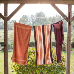 Linen towels weighs outside and dry on a rope; with the view